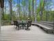Spacious outdoor deck with dining furniture and nature views, perfect for outdoor entertainment at 109 Barcliff Ter, Cary, NC 27518