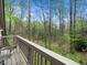 Relaxing balcony with a picturesque view of the surrounding trees and natural landscape at 109 Barcliff Ter, Cary, NC 27518