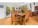 Inviting dining area with bamboo floors, natural light and views to the kitchen and outdoor deck at 109 Barcliff Ter, Cary, NC 27518