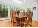 Light filled dining area with skylight, floor to ceiling windows and a door to the outdoor deck at 109 Barcliff Ter, Cary, NC 27518