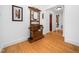 Inviting entryway with hardwood floors, coat rack, and view of the staircase to welcome you home at 109 Barcliff Ter, Cary, NC 27518