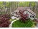 Aerial view of home with a charming walkway, complemented by mature trees and a spacious deck at 109 Barcliff Ter, Cary, NC 27518