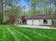 Well-maintained exterior with a two-car garage and a beautifully manicured lawn at 109 Barcliff Ter, Cary, NC 27518