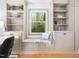Charming home office with custom built-ins and window seat overlooking lush greenery at 109 Barcliff Ter, Cary, NC 27518