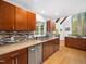 The kitchen features stainless steel appliances, granite counters, and a decorative tile backsplash at 109 Barcliff Ter, Cary, NC 27518