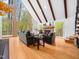 Cozy living room featuring a fireplace, vaulted ceilings, and large windows providing plenty of natural light and scenic views at 109 Barcliff Ter, Cary, NC 27518