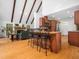 Open floorplan offering a modern kitchen with breakfast bar that flows into the great room with a stone fireplace at 109 Barcliff Ter, Cary, NC 27518