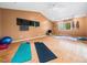 Bright workout room with hardwood floors and ample space for exercise equipment at 109 Barcliff Ter, Cary, NC 27518