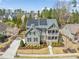 Stunning aerial view of a home with solar panels, landscaping, and a pristine yard at 113 Bennett Mountain Trce, Chapel Hill, NC 27516