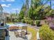 Backyard view of patio, fire pit, basketball court, and extensive landscaping, creating an inviting outdoor space at 113 Bennett Mountain Trce, Chapel Hill, NC 27516