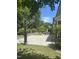 Landscaped backyard featuring a patio, dining area, and basketball hoop, surrounded by lush greenery at 113 Bennett Mountain Trce, Chapel Hill, NC 27516
