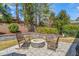 Beautiful backyard featuring a stone fire pit and comfortable seating, perfect for relaxing outdoors at 113 Bennett Mountain Trce, Chapel Hill, NC 27516