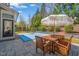 Charming backyard with patio, outdoor dining set, and a basketball court, ideal for entertaining at 113 Bennett Mountain Trce, Chapel Hill, NC 27516