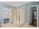 Beautiful bathroom with a glass-enclosed shower, tile walls, and easy access to the bedroom at 113 Bennett Mountain Trce, Chapel Hill, NC 27516