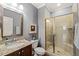 Bathroom featuring granite vanity, glass-enclosed shower, and gray wall color at 113 Bennett Mountain Trce, Chapel Hill, NC 27516