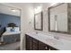 Bright bathroom featuring a double vanity with dark wood cabinets and white marble countertop at 113 Bennett Mountain Trce, Chapel Hill, NC 27516