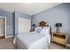 Bedroom with wooden headboard, two side tables, and a closet on the left at 113 Bennett Mountain Trce, Chapel Hill, NC 27516