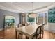 Spacious dining room with a large mirror reflecting the stylish decor and ample seating at 113 Bennett Mountain Trce, Chapel Hill, NC 27516