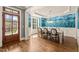 Dining room with hardwood floors, blue floral wallpaper, and a crystal chandelier at 113 Bennett Mountain Trce, Chapel Hill, NC 27516