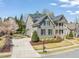 A beautiful two-story home with solar panels, a well-maintained yard, and a charming exterior design at 113 Bennett Mountain Trce, Chapel Hill, NC 27516