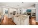 Spacious kitchen featuring a large island, stainless appliances, and a view to the living space at 113 Bennett Mountain Trce, Chapel Hill, NC 27516