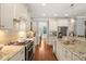 Well-appointed kitchen with stainless appliances, granite counters, and ample cabinet space at 113 Bennett Mountain Trce, Chapel Hill, NC 27516