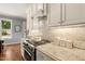 Bright kitchen featuring granite countertops, stainless steel oven and ample counter space at 113 Bennett Mountain Trce, Chapel Hill, NC 27516