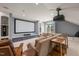 Spacious living room with a large projection screen, comfortable seating, and a modern design at 113 Bennett Mountain Trce, Chapel Hill, NC 27516