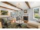 Comfortable living room showcasing a stone fireplace, hardwood floors, and natural light at 113 Bennett Mountain Trce, Chapel Hill, NC 27516