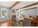 Cozy living room featuring wood beams, fireplace, and comfortable seating area at 113 Bennett Mountain Trce, Chapel Hill, NC 27516