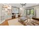 Spacious living room featuring built-in shelving, hardwood floors, and comfortable seating at 113 Bennett Mountain Trce, Chapel Hill, NC 27516