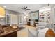 Charming living room with a built-in desk, hardwood floors, and comfortable seating at 113 Bennett Mountain Trce, Chapel Hill, NC 27516