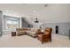 Spacious living room with comfortable seating, projector, speakers and a large window with a view at 113 Bennett Mountain Trce, Chapel Hill, NC 27516