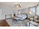 Spacious main bedroom with hardwood floors, a ceiling fan, and an ensuite bathroom at 113 Bennett Mountain Trce, Chapel Hill, NC 27516