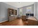 Office with hardwood floors, natural light, built-in shelving, and space for a workstation at 113 Bennett Mountain Trce, Chapel Hill, NC 27516