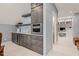 Entertainer's wet bar featuring a mini fridge, microwave, and stylish countertop, plus an office space at 113 Bennett Mountain Trce, Chapel Hill, NC 27516