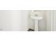 Bathroom featuring white pedestal sink and dark-tone floors at 1164 Solace Way, Rolesville, NC 27571