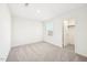 Sun-filled bedroom featuring plush carpeting, and an adjoining closet at 1164 Solace Way, Rolesville, NC 27571
