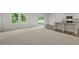 Open floor plan with hardwood floors and access to the backyard at 1164 Solace Way, Rolesville, NC 27571