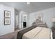 Serene primary bedroom featuring neutral decor, an ensuite bathroom, and plenty of natural light at 1164 Solace Way, Rolesville, NC 27571