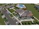 Aerial view of the community featuring clubhouse, green space, and pool at 1169 Solace Way, Rolesville, NC 27571