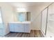 Modern bathroom featuring a vanity with drawers and a glass-enclosed shower at 1169 Solace Way, Rolesville, NC 27571