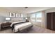 Comfortable main bedroom featuring carpet flooring, and a large window at 1169 Solace Way, Rolesville, NC 27571