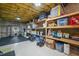 Unfinished basement space with storage shelving and exercise equipment at 118 Benedum Pl, Cary, NC 27518
