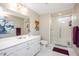 Bright bathroom with a white vanity and a glass-enclosed shower at 118 Benedum Pl, Cary, NC 27518