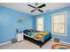 Colorful bedroom featuring playful décor, a ceiling fan and lots of natural light at 118 Benedum Pl, Cary, NC 27518