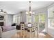 Inviting dining area with access to outdoor patio, perfect for entertaining and enjoying the view at 118 Benedum Pl, Cary, NC 27518