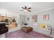 Spacious living room with a view of the kitchen, featuring modern decor and ample seating at 118 Benedum Pl, Cary, NC 27518