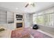 Cozy living room with fireplace, built-in shelves, and an abundance of natural light at 118 Benedum Pl, Cary, NC 27518