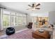 Bright and airy living room with multiple windows, kitchen views and stylish furnishings at 118 Benedum Pl, Cary, NC 27518